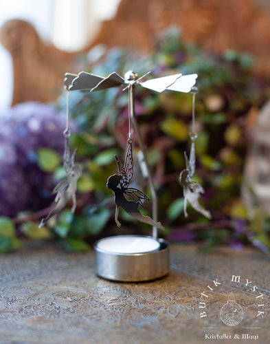 Rotating candle holder with fairy