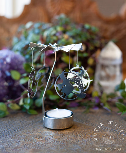 Rotating candle holder with witches