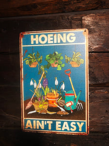 Tin sign - Hoeing ain't easy